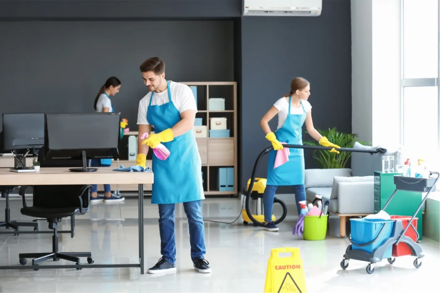 Cleaner mopping the entry floor of an office building